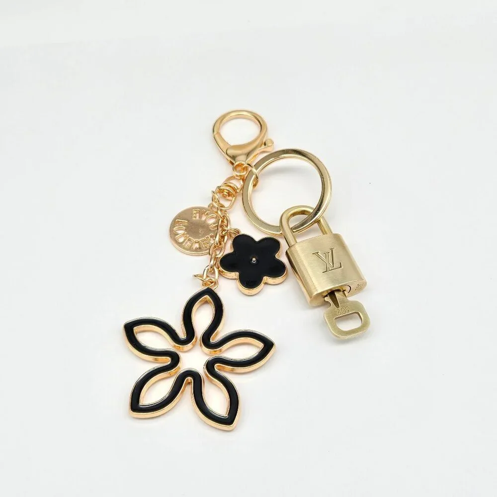 Louis Vuitton Gold-Tone Crystal Flower Keychain with Black Accent